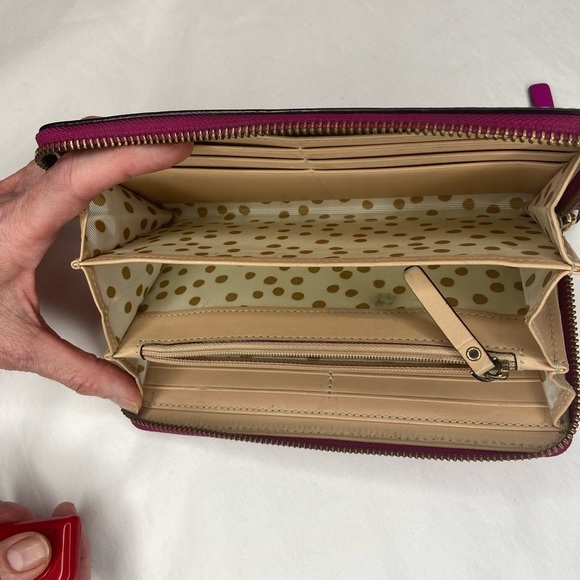 Leather Zip Around Wallet by Kate Spade in magenta.

Length: 7.75",  Height: 4" - Picture 5 of 6